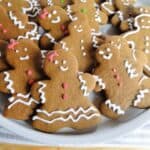 Gingerbread Men Cookies on white round platter.