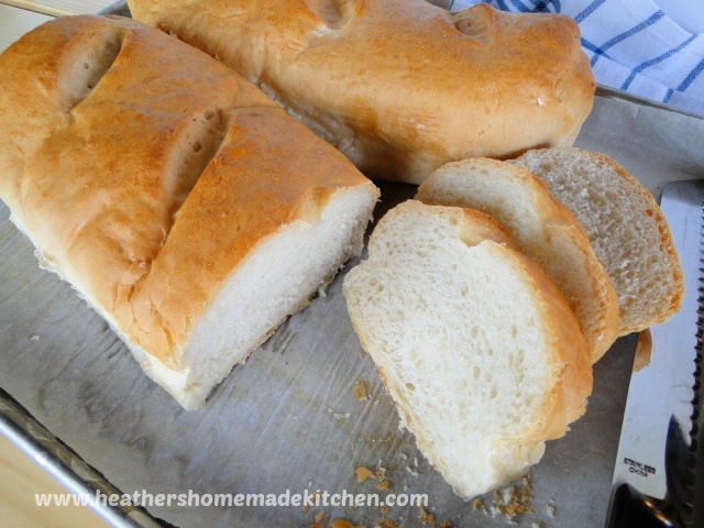 Homemade French Bread with 3 slices.
