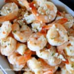 Top view of Garlic Butter Shrimp in white oval serving dish.
