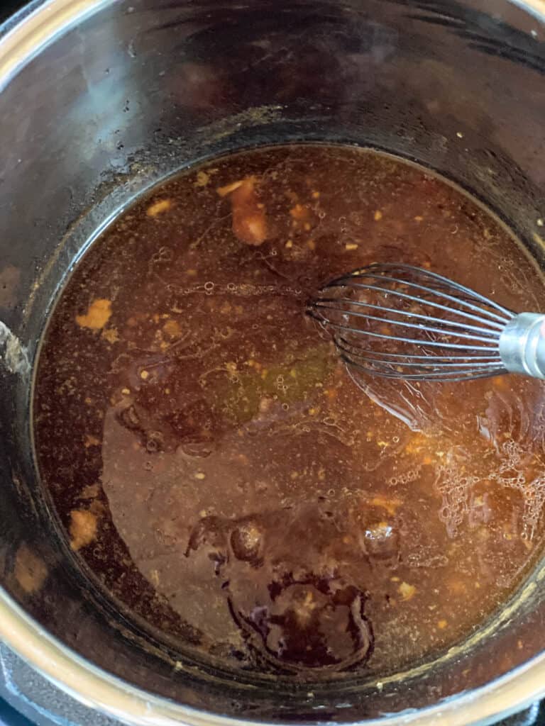 Sauce with corn starch stirred in with whisk.