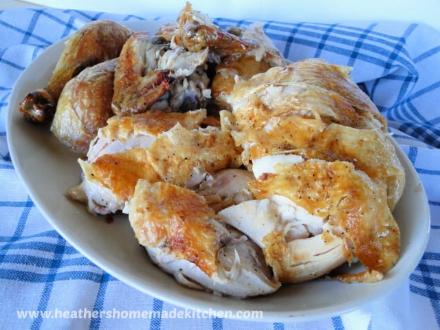 Perfect Roast Chicken carved and on white platter 