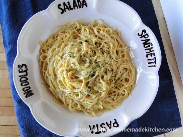 Top view of Classic Spaghetti Carbonara in white pasta bowl.