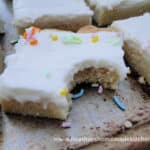 Front view of Sugar Cookie Bars with bite taken out of one bar.