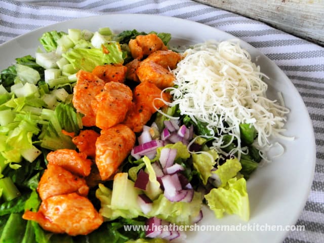 Buffalo Chicken Salad Buffalo Chicken Salad with celery, red onion and shredded provolone cheese.