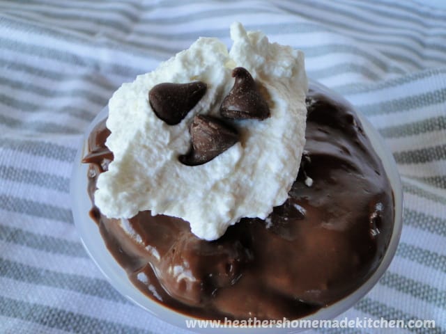 Homemade Chocolate Pudding topped with whipped cream and chocolate chips