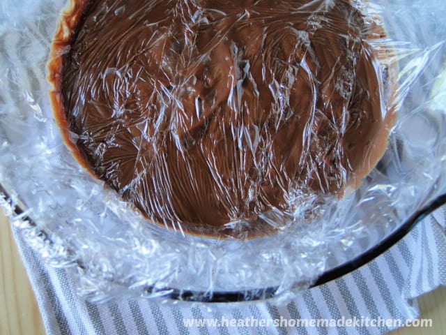 Homemade Chocolate Pudding in glass bowl with plastic wrap