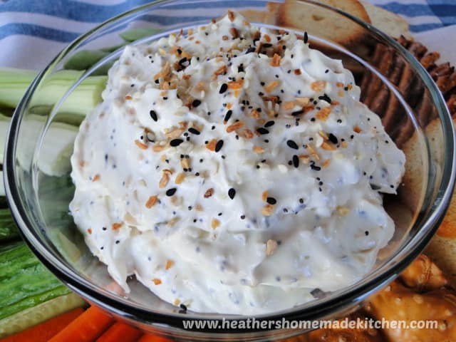Everything Bagel Dip in clear glass bowl Close view Everything Bagel Dip in clear glass bowl.