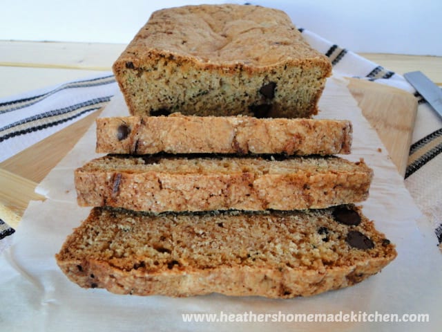 Chocolate Chip Zucchini Bread front view with 3 slices on bamboo board.