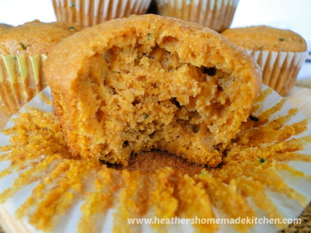 Close up view of Pumpkin Zucchini Muffins with bite taken out.