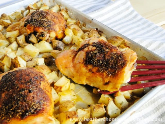 Pan Roasted Chicken & Potatoes with chicken on spatula.