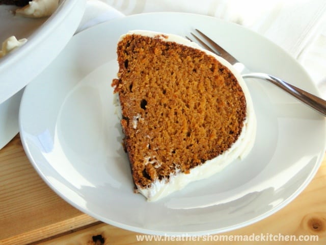 Close up view of Pumpkin Pie Bundt Cake slice on white round plate.