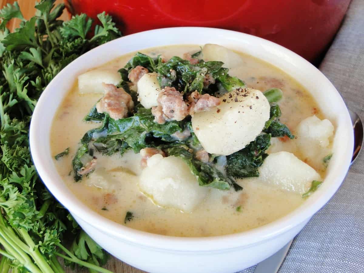 Bowlful of Easy Zuppa Toscana Soup in white bowl.
