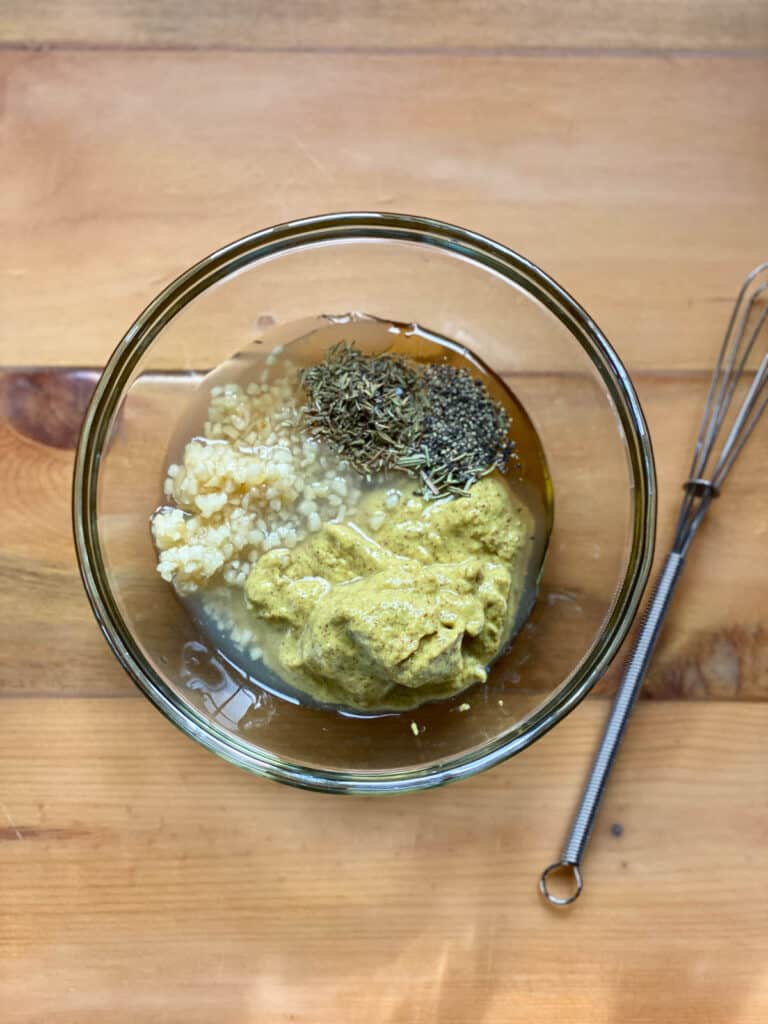 Honey mustard sauce ingredients in bowl.