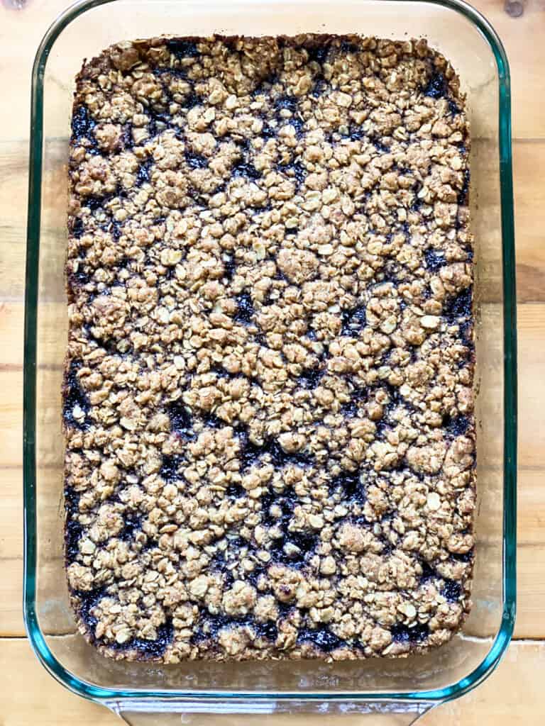 Baked blueberry cereal bars in baking dish.