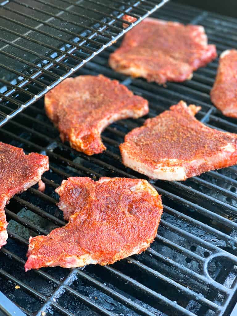 Rubbed pork chops on grill.