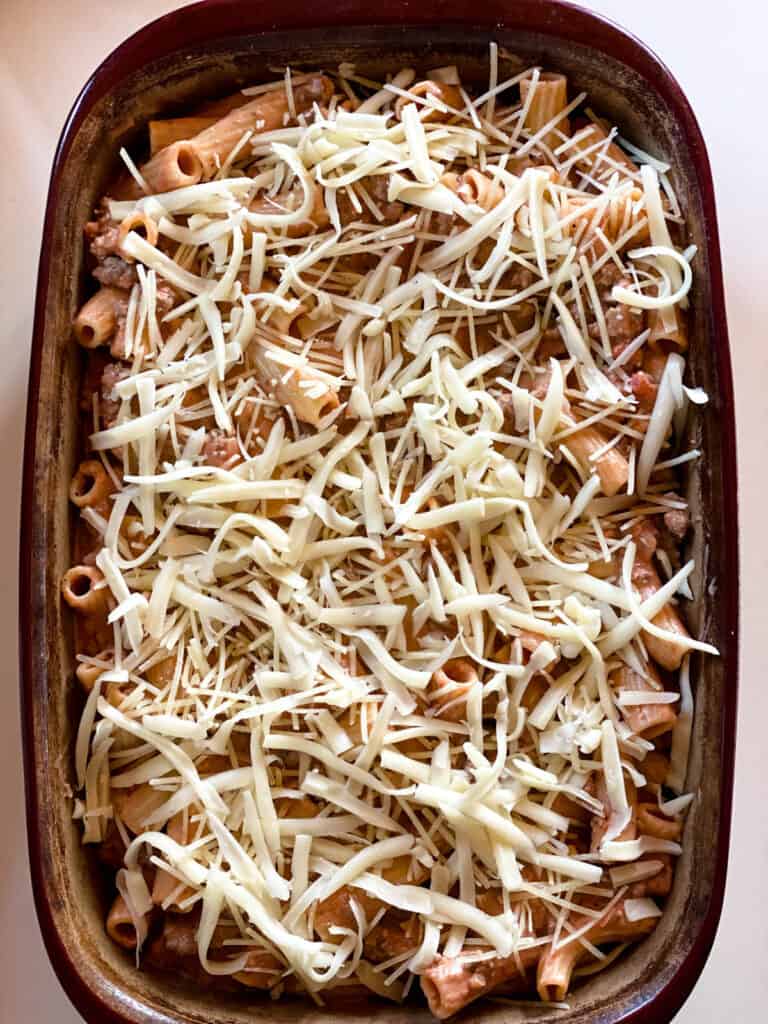 More cheese sprinkled on top of casserole.