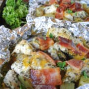 Chicken bacon ranch foil packets opened on a sheet pan.
