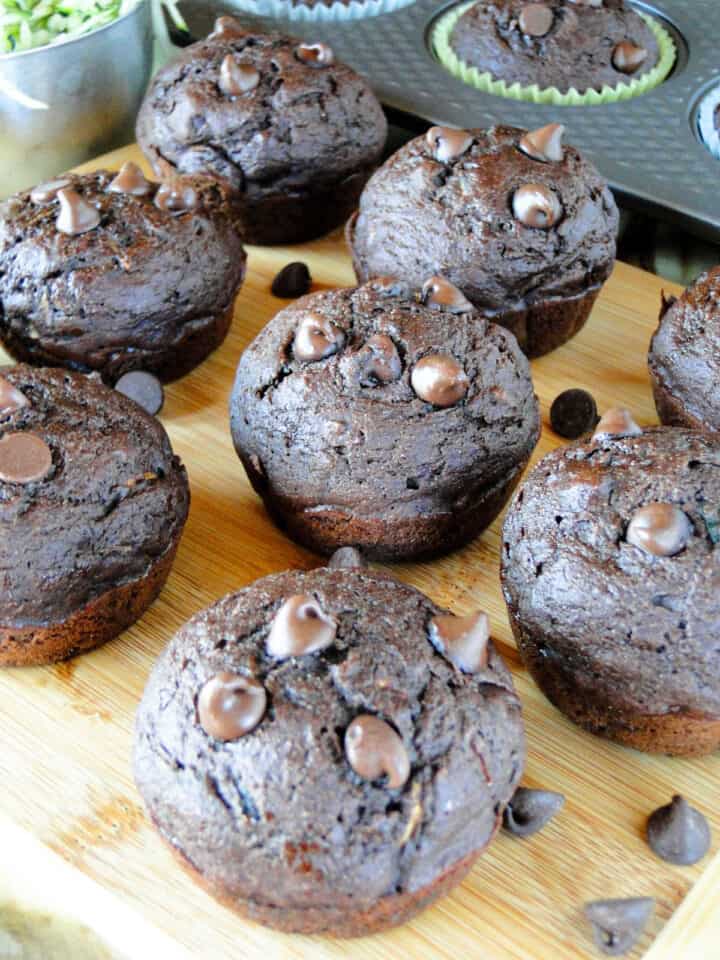 Close up view of healthy double chocolate zucchini muffins on board.