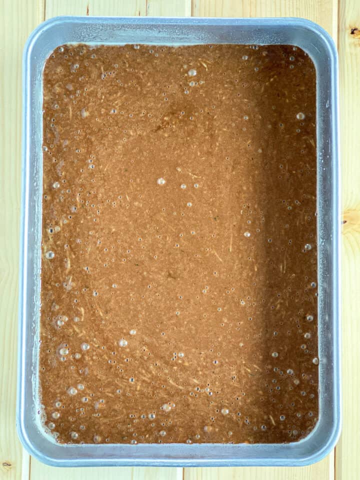 Cake batter in 9x13 cake pan.