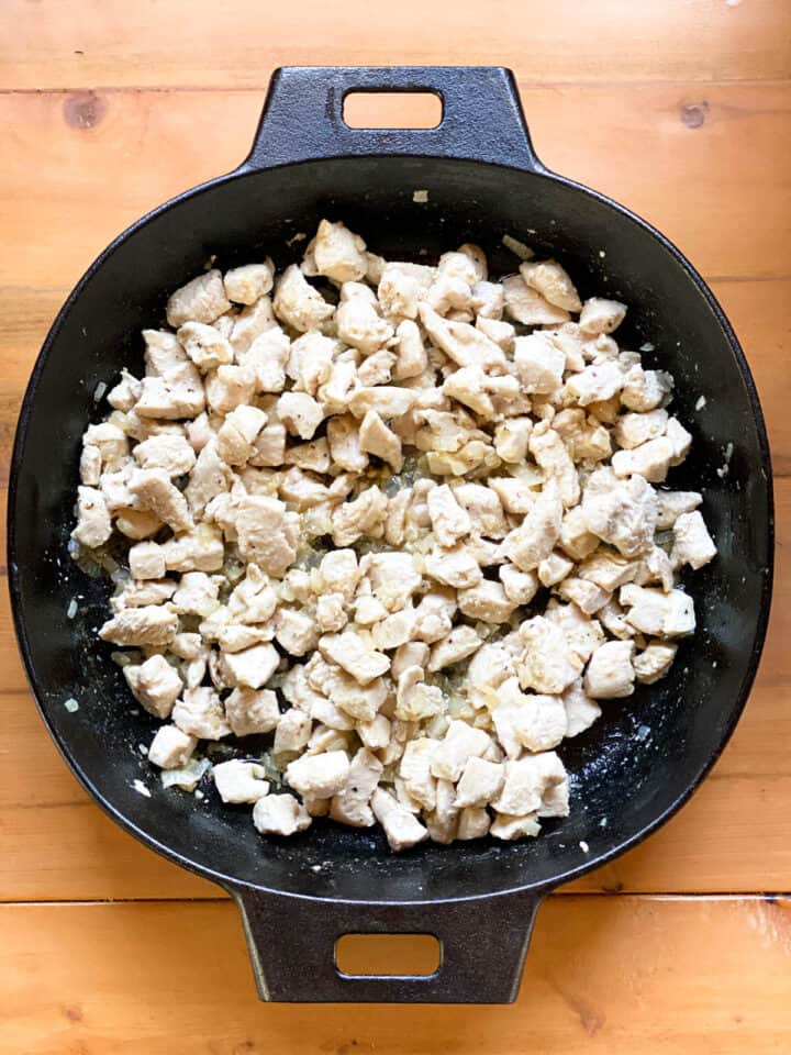 Cooked chicken in skillet.