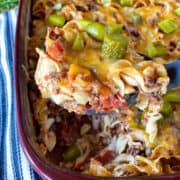 Easy cheeseburger casserole being scooped out of casserole dish.