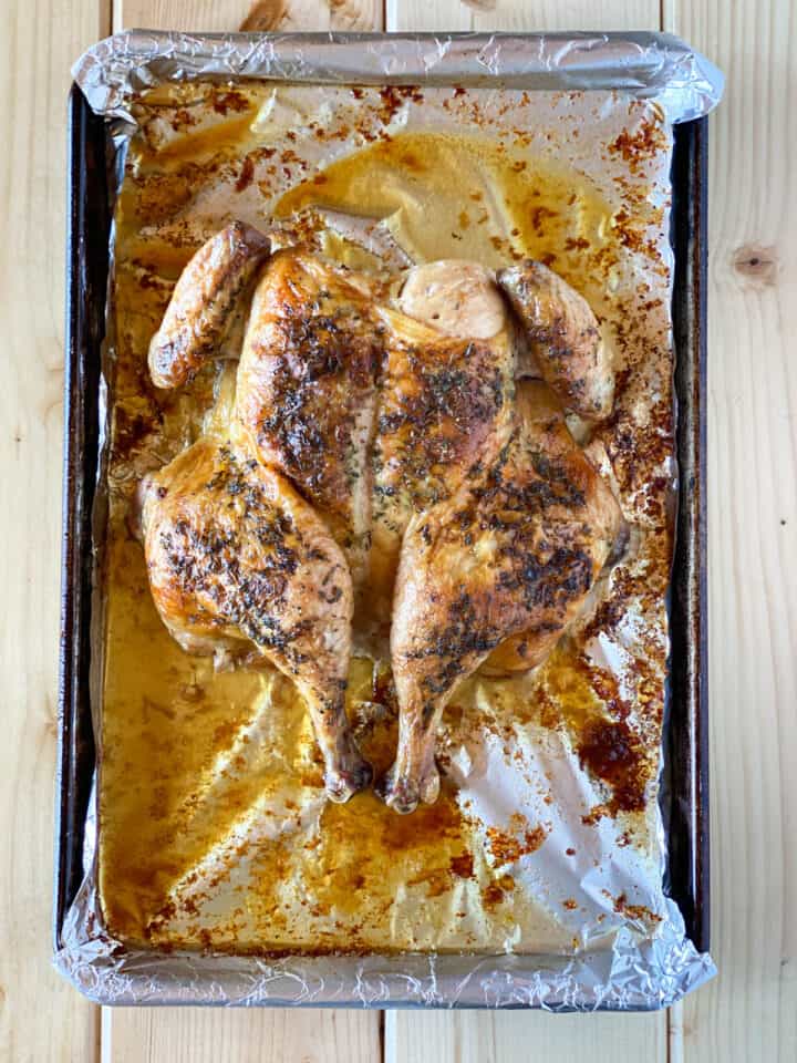 Cooked chicken on sheet pan.