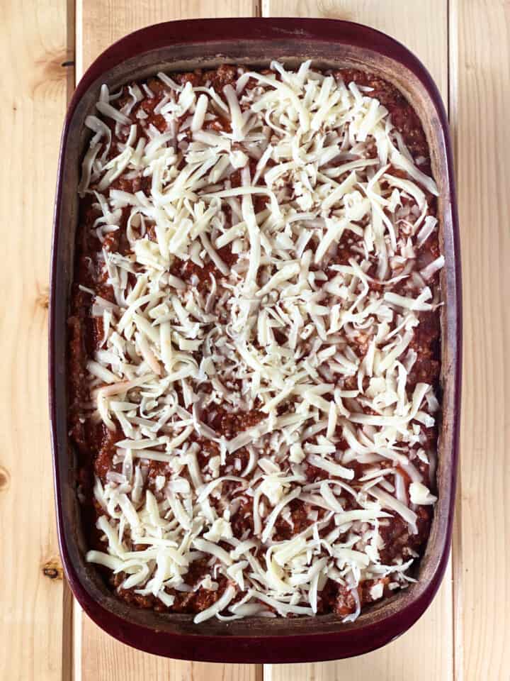 Completely assembled lasagna in casserole dish.