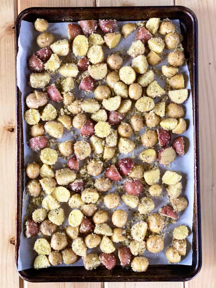Potatoes in single layer on sheet pan.