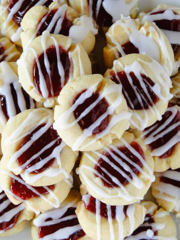 Close up top view of raspberry almond thumbprint cookies.