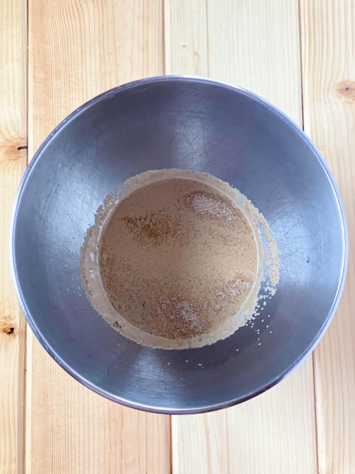 Water and yeast in mixing bowl.