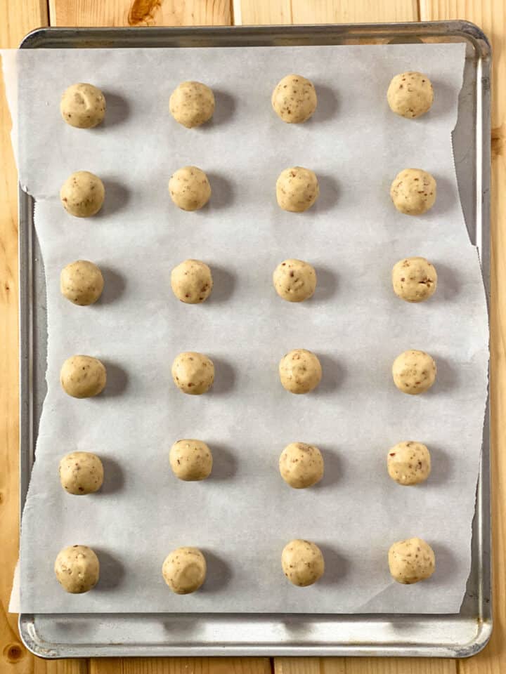 Rolled cookies on baking sheet ready for oven.
