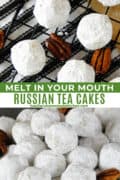 Russian tea cakes on wire rack on piled high on plate.