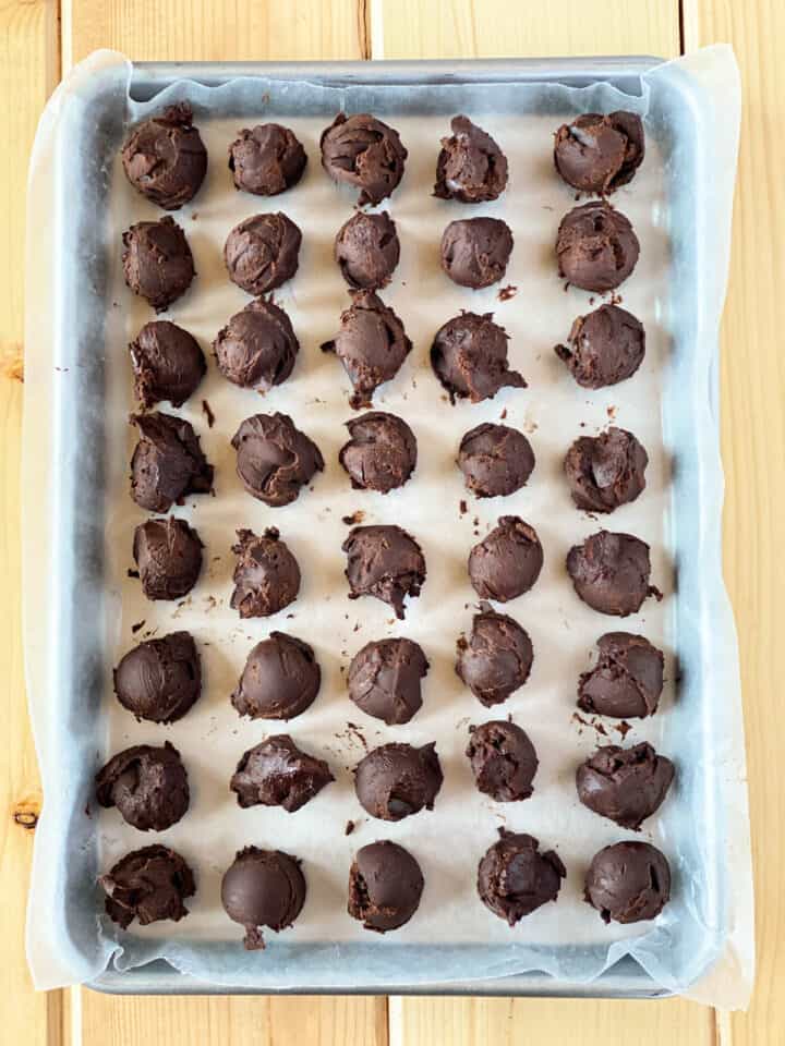 Scooped chocolate on sheet pan.