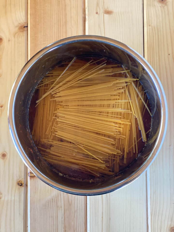 Broth added over top of the pasta in instant pot.