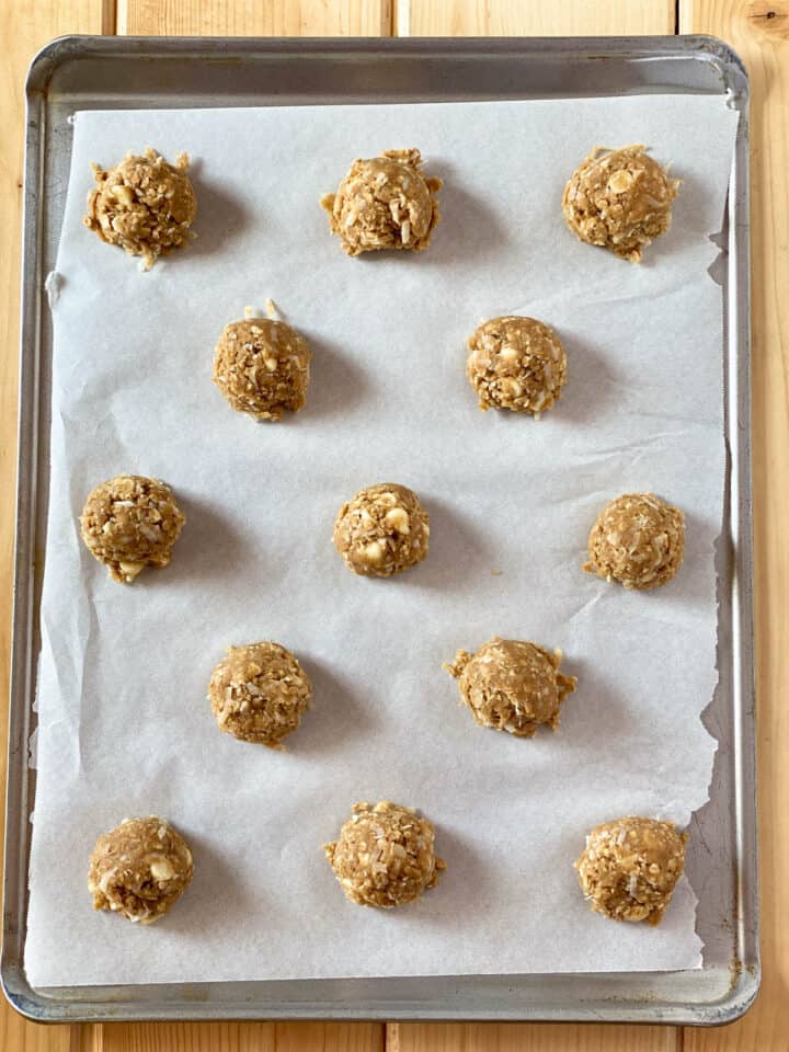 Cookie dough on parchment lined cookie sheet.