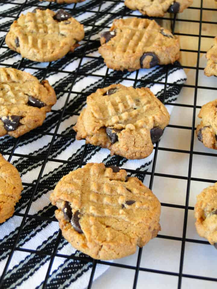 Close up of four ingredient peanut butter cookies on wire rack.