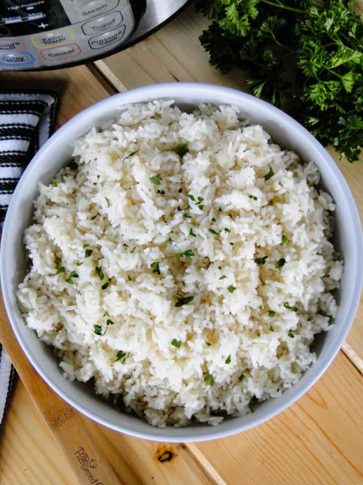 Top view of instant pot white rice in white round bowl.