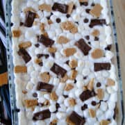 Top view of smores brownies in glass baking dish.