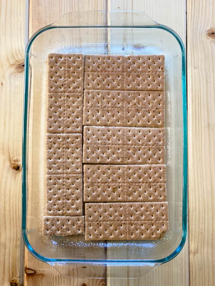 Layer of graham crackers in bottom of glass baking dish.