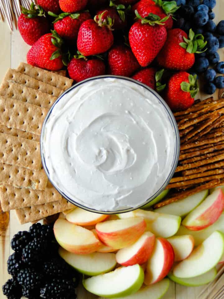 Bowl of yogurt fruit dip in center of fruit platter.