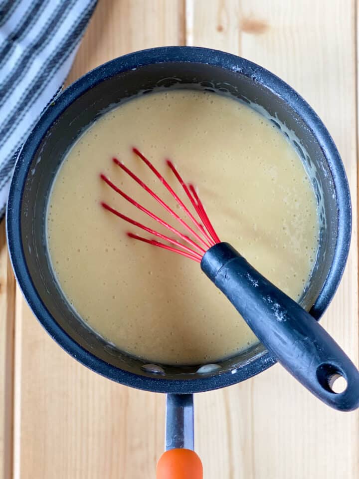 Complete cake batter in sauce pan with whisk.