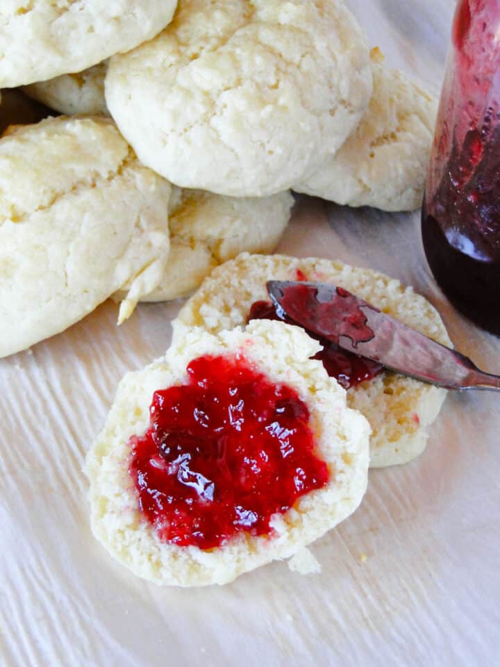Easy drop biscuits with a biscuit cut in half and jelly on it.