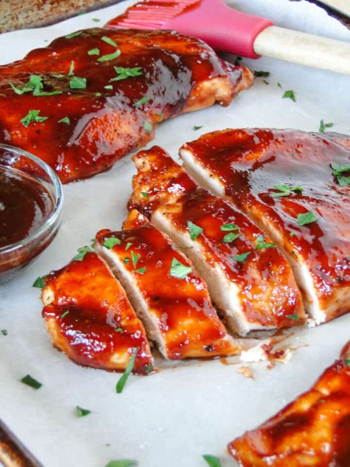 Close up side view of Oven roasted BBQ chicken slices.