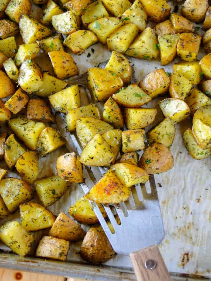 Top view of roasted ranch potatoes on spatula.