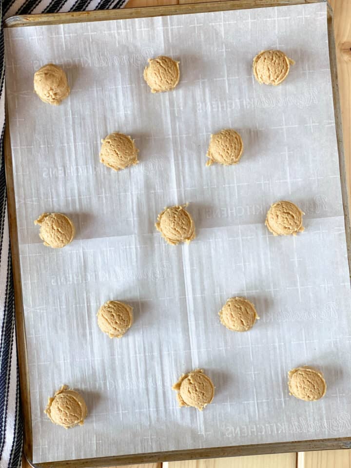 Graham cracker cookie dough on parchment lined cookie sheet.