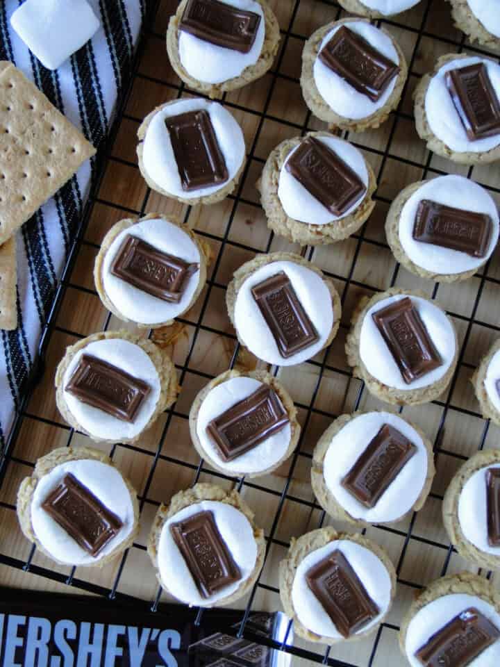 Top view of s'mores cookies in rows on wire rack.