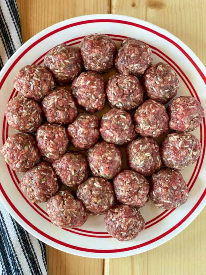Rolled meatballs on plate.