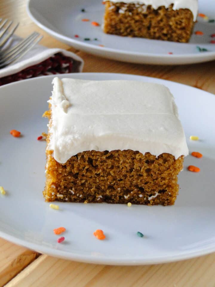 Close upside view of pumpkin bar with cream cheese frosting.