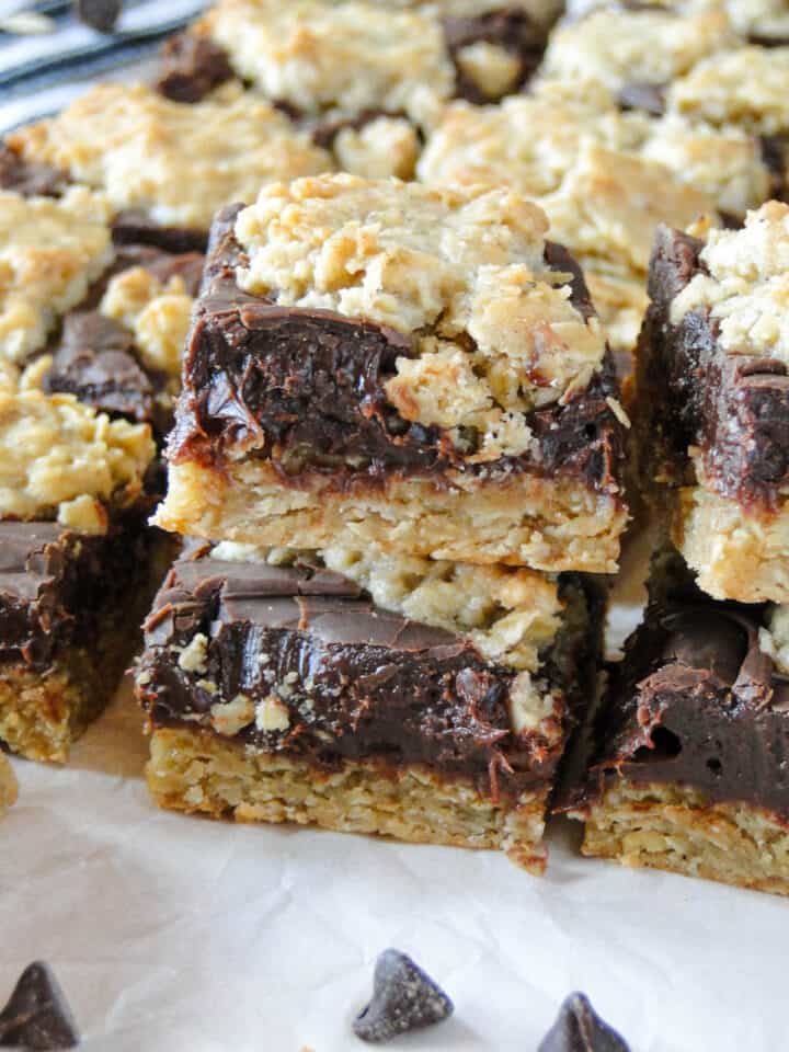 Side view of two oatmeal fudge bars stacked next to other bars.