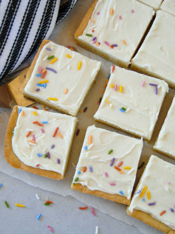 Close up view of sliced sugar cookie bars with spatula.